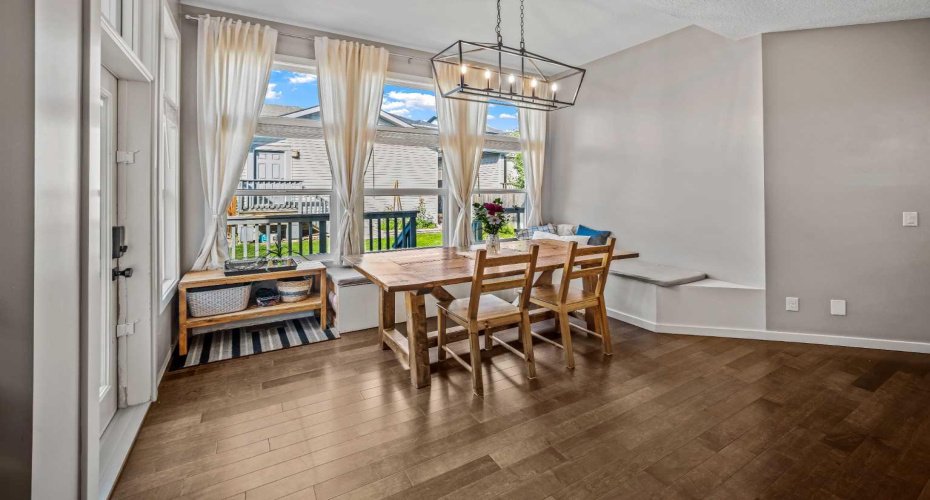 A spacious dining nook with built in seating and room for a full sized table.
