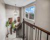 The open upper landing brings light into the stairwell and adds architectural interest.