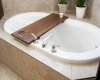The corner soaker tub creates a relaxing focal point in the primary ensuite.