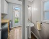 A convenient main floor powder room sits beside the laundry and rear entry.