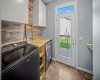 The laundry room includes storage, workspace and direct access to the backyard.