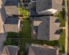 Aerial view highlighting the detached garage, spacious backyard and convenient rear parking pad.