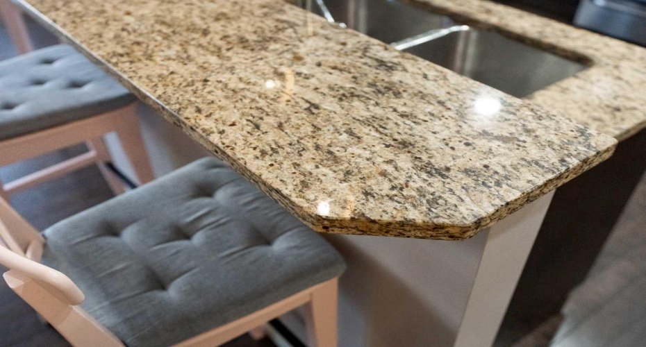 Granite counters add durable, polished surfaces throughout the kitchen and bathrooms.