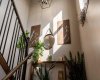Sunlight and greenery create a warm, organic feel throughout the living spaces.