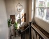 The open stairwell is finished with modern railings and thoughtful decorative touches.