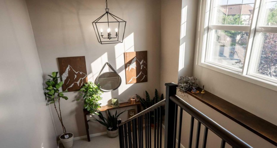 The open stairwell is finished with modern railings and thoughtful decorative touches.
