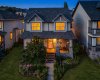 A final twilight exterior captures the warmth and welcoming character of the home.