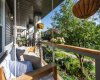 Front porch swing to sit and enjoy the established garden.