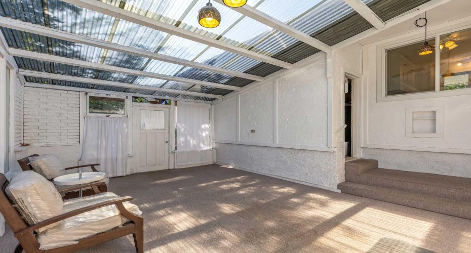 sun room , access to the garage and backyard