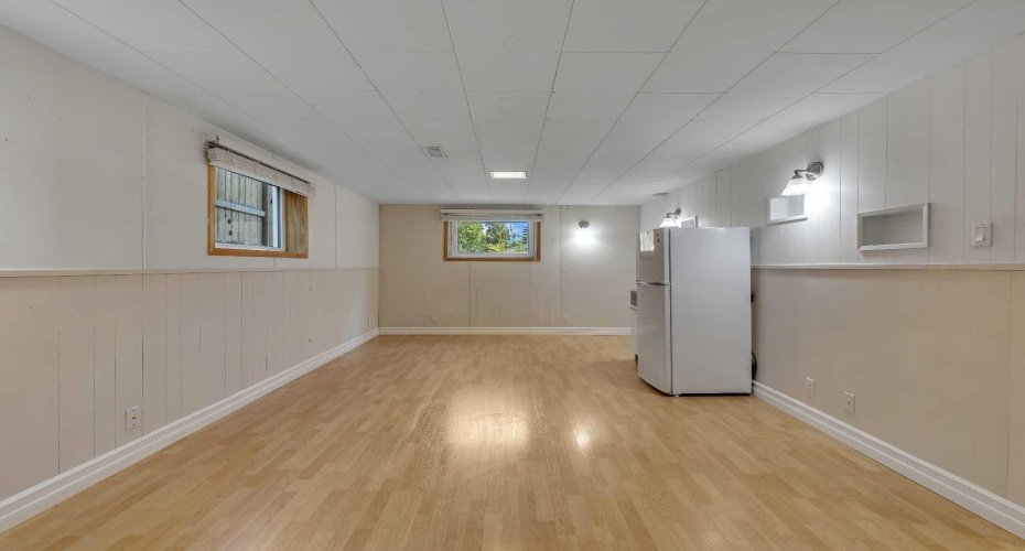 large recreation room with sub-floor  and egress windows