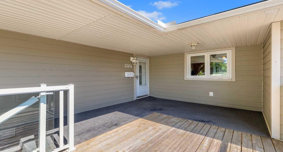 front deck with glass railing , facing to  green space,