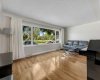 open living room with  upgraded window, overlooking to the green space