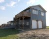 Upper level of this garage has 13ft vault and a 250 sq ft deck. Great views from up there.