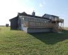 Sun-room is completely closed in with wall to wall windows, full roof ,and dura deck on the floor. The sun-room is 350 sq ft