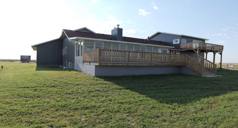 Sun-room is completely closed in with wall to wall windows, full roof ,and dura deck on the floor. The sun-room is 350 sq ft