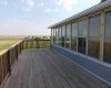 Deck off of sun-room. Tons of the windows open for venting and airflow.