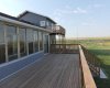 Huge deck, patio doors from sun-room.