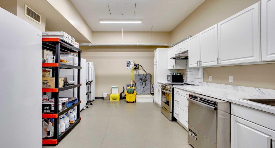 Small kitchen behind breakfast room